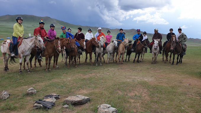 Horseback riding tour group in the Mongolian countryside